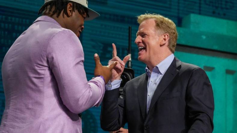 Apr 27, 2023; Kansas City, MO, USA; Georgia defensive lineman Jalen Carter reacts with NFL commissioner Roger Goodell after being selected by the Philadelphia Eagles ninth overall in the first round of the 2023 NFL Draft at Union Station. Mandatory Credit: Kirby Lee-USA TODAY Sports