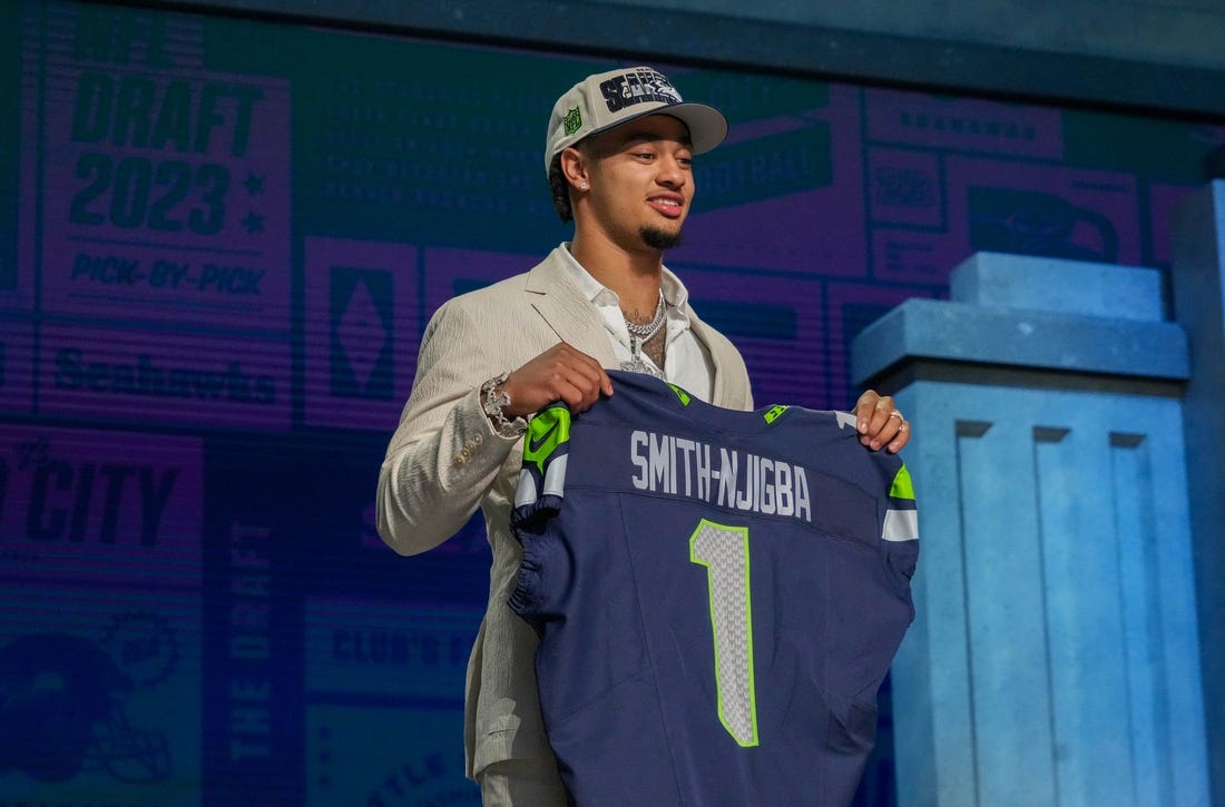 Apr 27, 2023; Kansas City, MO, USA; Ohio State wide receiver Jaxon Smith-Njigba on stage after being selected by the Seattle Seahawks twentieth overall in the first round of the 2023 NFL Draft at Union Station. Mandatory Credit: Kirby Lee-USA TODAY Sports