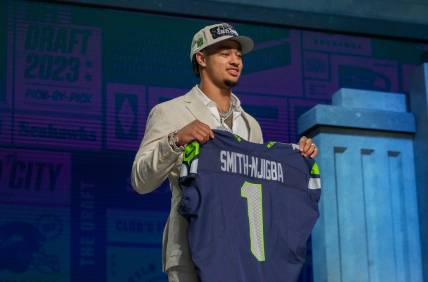 Apr 27, 2023; Kansas City, MO, USA; Ohio State wide receiver Jaxon Smith-Njigba on stage after being selected by the Seattle Seahawks twentieth overall in the first round of the 2023 NFL Draft at Union Station. Mandatory Credit: Kirby Lee-USA TODAY Sports