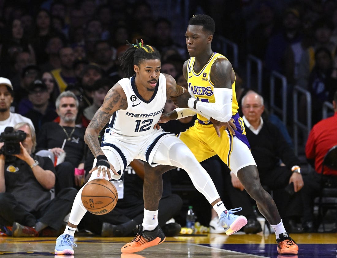 Apr 28, 2023; Los Angeles, California, USA; Los Angeles Lakers guard Dennis Schroder (17) defends Memphis Grizzlies guard Ja Morant (12) in the first half of game six of the 2023 NBA playoffs at Crypto.com Arena. Mandatory Credit: Jayne Kamin-Oncea-USA TODAY Sports