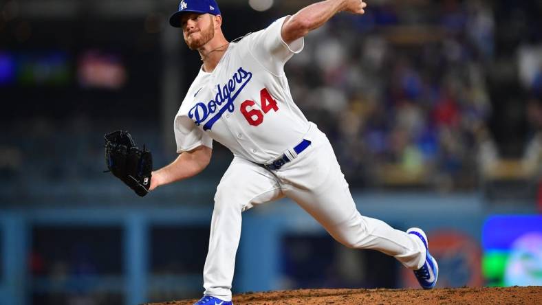 Apr 28, 2023; Los Angeles, California, USA; Los Angeles Dodgers relief pitcher Caleb Ferguson (64) throws against the St. Louis Cardinals during the sixth inning at Dodger Stadium. Mandatory Credit: Gary A. Vasquez-USA TODAY Sports