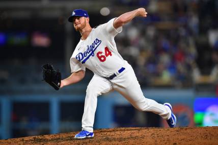 Apr 28, 2023; Los Angeles, California, USA; Los Angeles Dodgers relief pitcher Caleb Ferguson (64) throws against the St. Louis Cardinals during the sixth inning at Dodger Stadium. Mandatory Credit: Gary A. Vasquez-USA TODAY Sports