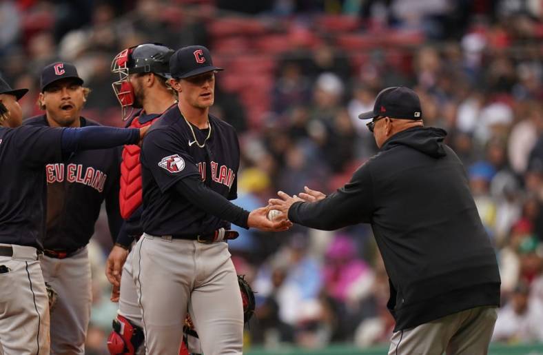 Apr 29, 2023; Boston, Massachusetts, USA; Cleveland Guardians starting pitcher Zach Plesac (34) is taken out of the game by manager Terry Francona (77) as they take on the Boston Red Sox in the fourth inning at Fenway Park. Mandatory Credit: David Butler II-USA TODAY Sports