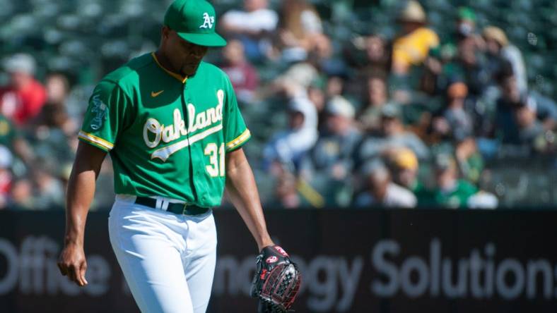 Apr 29, 2023; Oakland, California, USA; Oakland Athletics relief pitcher Jeurys Familia (31) walks back to the dugout after the top of the 9th inning at RingCentral Coliseum. Mandatory Credit: Ed Szczepanski-USA TODAY Sports