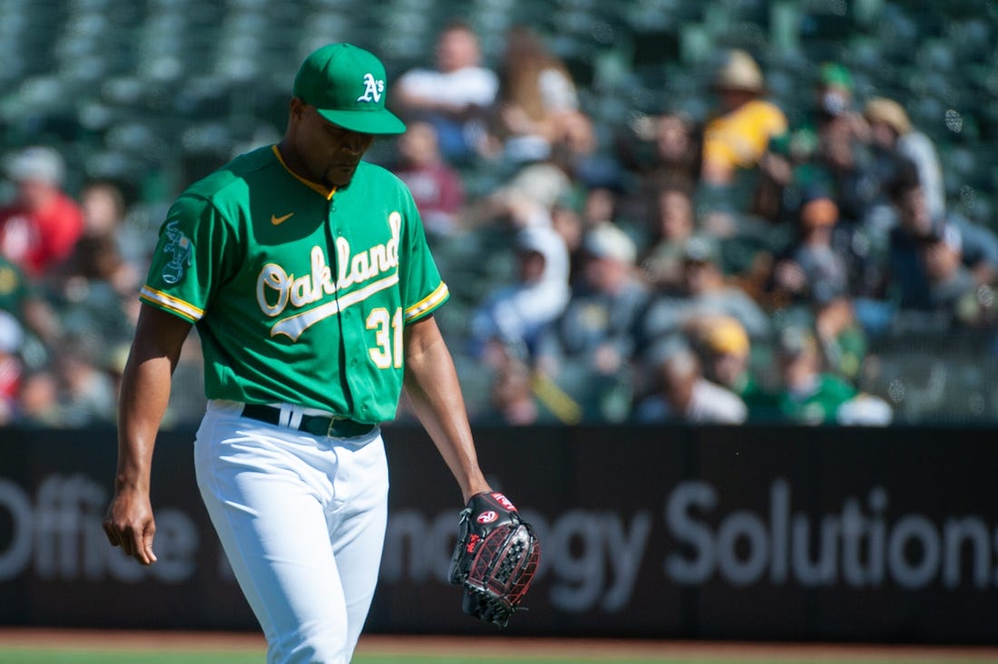 Apr 29, 2023; Oakland, California, USA; Oakland Athletics relief pitcher Jeurys Familia (31) walks back to the dugout after the top of the 9th inning at RingCentral Coliseum. Mandatory Credit: Ed Szczepanski-USA TODAY Sports