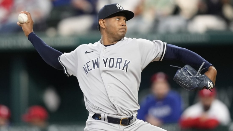 Apr 29, 2023; Arlington, Texas, USA; New York Yankees starting pitcher Jhony Brito (76) delivers against the Texas Rangers during the third inning at Globe Life Field. Mandatory Credit: Jim Cowsert-USA TODAY Sports