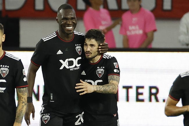 Apr 29, 2023; Washington, District of Columbia, USA; D.C. United forward Taxiarchis Fountas (11) celebrates with D.C. United forward Christian Benteke (20) after scoring on a penalty against Charlotte FC in the first half at Audi Field. Mandatory Credit: Geoff Burke-USA TODAY Sports