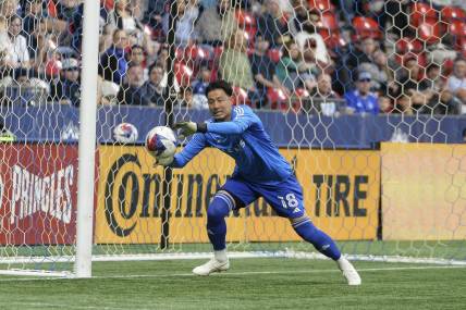 Apr 29, 2023; Vancouver, British Columbia, CAN;  Vancouver Whitecaps FC goalkeeper Yohei Takaoka (18) stops a shot on net by the Colorado Rapids during the second half at BC Place. Mandatory Credit: Anne-Marie Sorvin-USA TODAY Sports