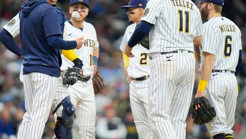 Brewers players meet at the pitching mound as they fall behind the Angels during the seventh inning on Sunday April 30, 2023 at American Family Field in Milwaukee, Wis.