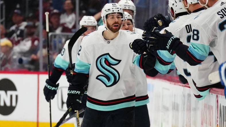 Apr 30, 2023; Denver, Colorado, USA; Seattle Kraken right wing Oliver Bjorkstrand (22) celebrates his goal in the second period against the Colorado Avalanche in game seven of the first round of the 2023 Stanley Cup Playoffs at Ball Arena. Mandatory Credit: Ron Chenoy-USA TODAY Sports