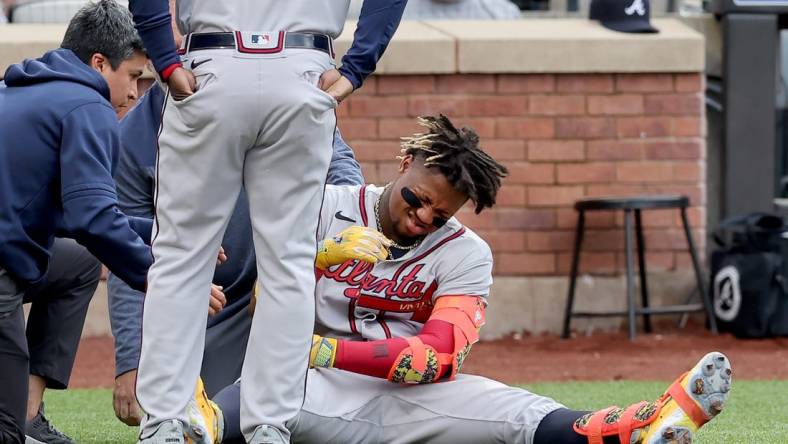 May 1, 2023; New York City, New York, USA; Atlanta Braves right fielder Ronald Acuna Jr. (13) reacts after being hit by a pitch during the first inning against the New York Mets at Citi Field. Acuna left the game for a pinch runner. Mandatory Credit: Brad Penner-USA TODAY Sports