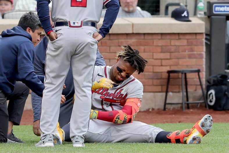 May 1, 2023; New York City, New York, USA; Atlanta Braves right fielder Ronald Acuna Jr. (13) reacts after being hit by a pitch during the first inning against the New York Mets at Citi Field. Acuna left the game for a pinch runner. Mandatory Credit: Brad Penner-USA TODAY Sports