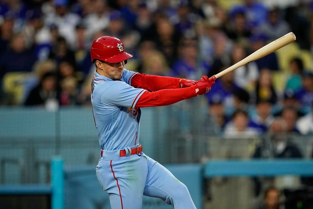 Apr 29, 2023; Los Angeles, California, USA; St. Louis Cardinals shortstop Tommy Edman (19) hits a single against the Los Angeles Dodgers during the sixth inning at Dodger Stadium. Mandatory Credit: Lucas Peltier-USA TODAY Sports