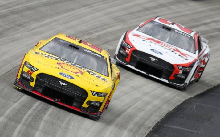 May 1, 2023; Dover, Delaware, USA; NASCAR Cup Series driver Joey Logano (22) races driver Harrison Burton (21) during the Wurth 400 at Dover Motor Speedway. Mandatory Credit: Matthew OHaren-USA TODAY Sports