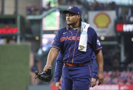 May 1, 2023; Houston, Texas, USA; Houston Astros starting pitcher Luis Garcia (77) walks to the dugout before the game against the San Francisco Giants at Minute Maid Park. Mandatory Credit: Troy Taormina-USA TODAY Sports