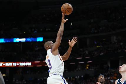 May 1, 2023; Denver, Colorado, USA; Phoenix Suns guard Chris Paul (3) shoots the ball in the first half against the Denver Nuggets during game two of the 2023 NBA playoffs at Ball Arena. Mandatory Credit: Ron Chenoy-USA TODAY Sports
