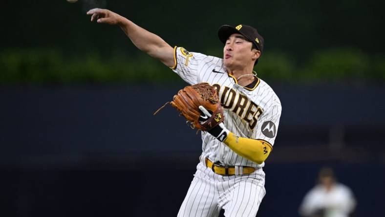 May 1, 2023; San Diego, California, USA; San Diego Padres second baseman Ha-Seong Kim (7) throws to first base during the sixth inning against the Cincinnati Reds at Petco Park. Mandatory Credit: Orlando Ramirez-USA TODAY Sports