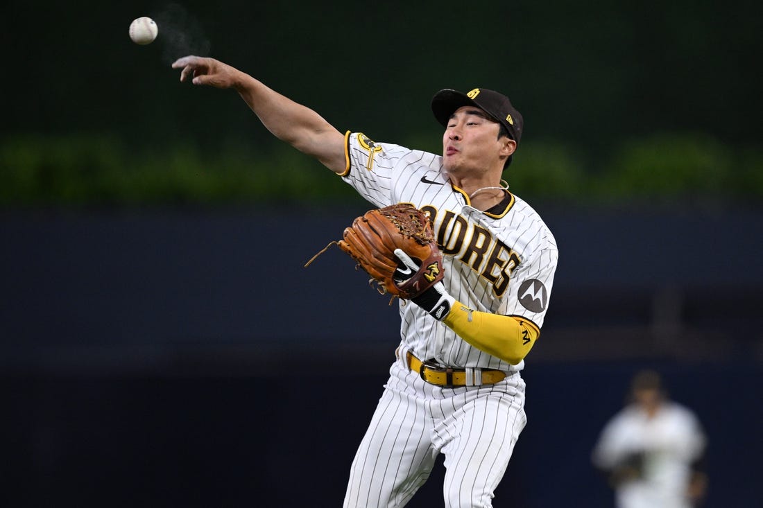 May 1, 2023; San Diego, California, USA; San Diego Padres second baseman Ha-Seong Kim (7) throws to first base during the sixth inning against the Cincinnati Reds at Petco Park. Mandatory Credit: Orlando Ramirez-USA TODAY Sports