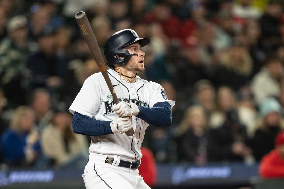 Apr 22, 2023; Seattle, Washington, USA; Seattle Mariners left fielder Jarred Kelenic (10) hits a double against the St. Louis Cardinals at T-Mobile Park. Mandatory Credit: Stephen Brashear-USA TODAY Sports