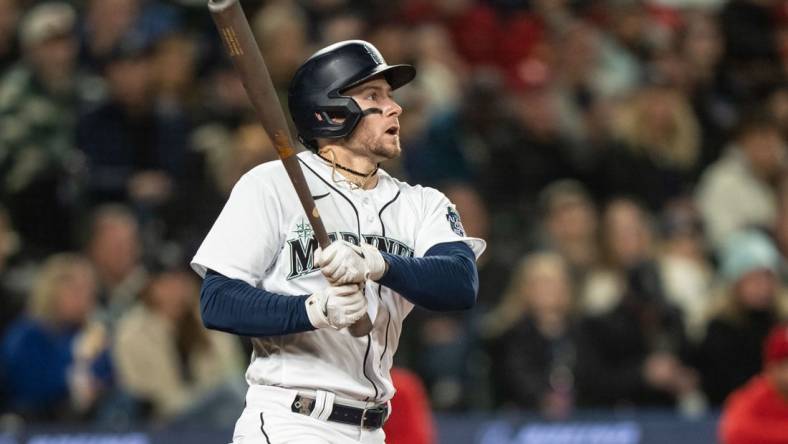 Apr 22, 2023; Seattle, Washington, USA; Seattle Mariners left fielder Jarred Kelenic (10) hits a double against the St. Louis Cardinals at T-Mobile Park. Mandatory Credit: Stephen Brashear-USA TODAY Sports