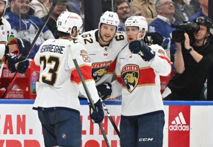 May 2, 2023; Toronto, Ontario, CANADA;   Florida Panthers forward Carter Verhaeghe (23) celebrates at the bench with defensemen Gustav Forsling (42) and Brandon Montour  (62) after scoring against the Toronto Maple Leafs in the second period in game one of the second round of the 2023 Stanley Cup Playoffs at Scotiabank Arena. Mandatory Credit: Dan Hamilton-USA TODAY Sports