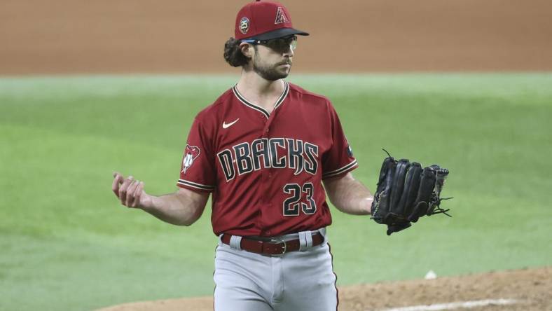 May 2, 2023; Arlington, Texas, USA; Arizona Diamondbacks starting pitcher Zac Gallen (23) reacts during the game against the Texas Rangers at Globe Life Field. Mandatory Credit: Kevin Jairaj-USA TODAY Sports