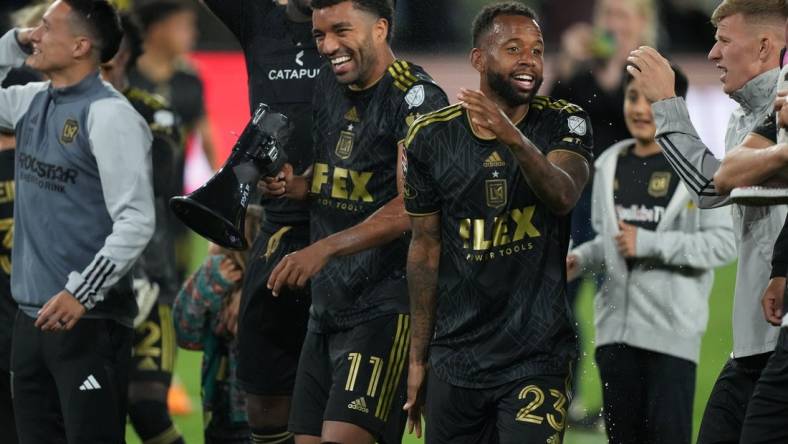 May 2, 2023; Los Angeles, CA, USA; LAFC midfielder Timothy Tillman (11) and midfielder Kellyn Acosta (23) celebrate after the game against the Philadelphia Union BMO Stadium. Mandatory Credit: Kirby Lee-USA TODAY Sports