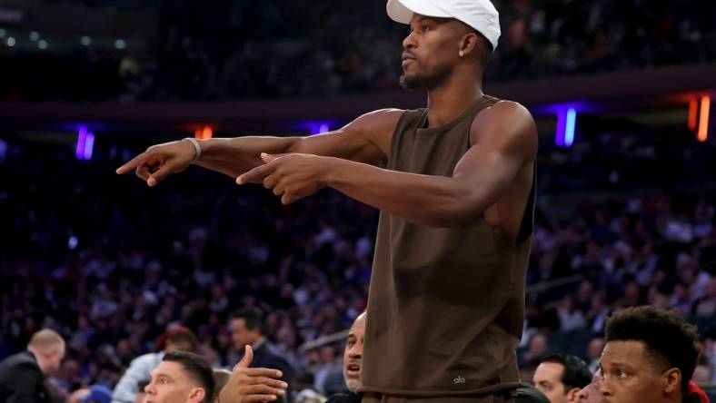 May 2, 2023; New York, New York, USA; Miami Heat injured forward Jimmy Butler (22) talks to his teammates from the bench during the third quarter of game two of the 2023 NBA Eastern Conference semifinal playoffs against the New York Knicks at Madison Square Garden. Mandatory Credit: Brad Penner-USA TODAY Sports