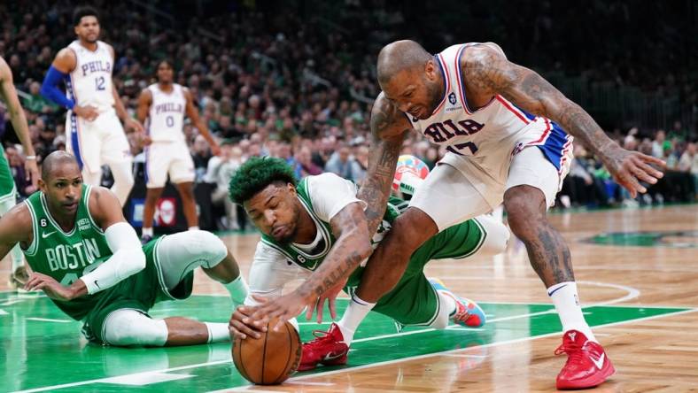 May 3, 2023; Boston, Massachusetts, USA; Boston Celtics guard Marcus Smart (36) works for the ball against Philadelphia 76ers forward P.J. Tucker (17) in the first quarter during game two of the 2023 NBA playoffs at TD Garden. Mandatory Credit: David Butler II-USA TODAY Sports