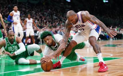 May 3, 2023; Boston, Massachusetts, USA; Boston Celtics guard Marcus Smart (36) works for the ball against Philadelphia 76ers forward P.J. Tucker (17) in the first quarter during game two of the 2023 NBA playoffs at TD Garden. Mandatory Credit: David Butler II-USA TODAY Sports
