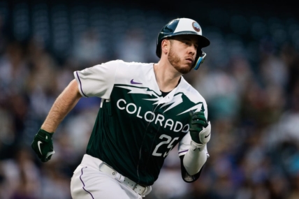 May 3, 2023; Denver, Colorado, USA; Colorado Rockies first baseman C.J. Cron (25) runs to second on a double in the fourth inning against the Milwaukee Brewers at Coors Field. Mandatory Credit: Isaiah J. Downing-USA TODAY Sports
