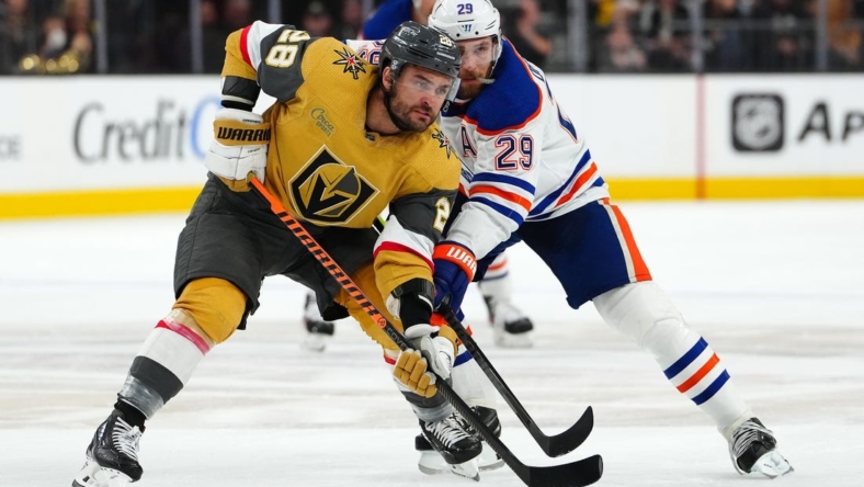 May 3, 2023; Las Vegas, Nevada, USA; Vegas Golden Knights left wing William Carrier (28) jostles with Edmonton Oilers center Leon Draisaitl (29) during a first period face off in game one of the second round of the 2023 Stanley Cup Playoffs at T-Mobile Arena. Mandatory Credit: Stephen R. Sylvanie-USA TODAY Sports