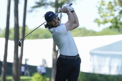 May 4, 2023; Charlotte, North Carolina, USA; Tommy Fleetwood hits his second shot on ten during the first round of the Wells Fargo Championship golf tournament. Mandatory Credit: Jim Dedmon-USA TODAY Sports