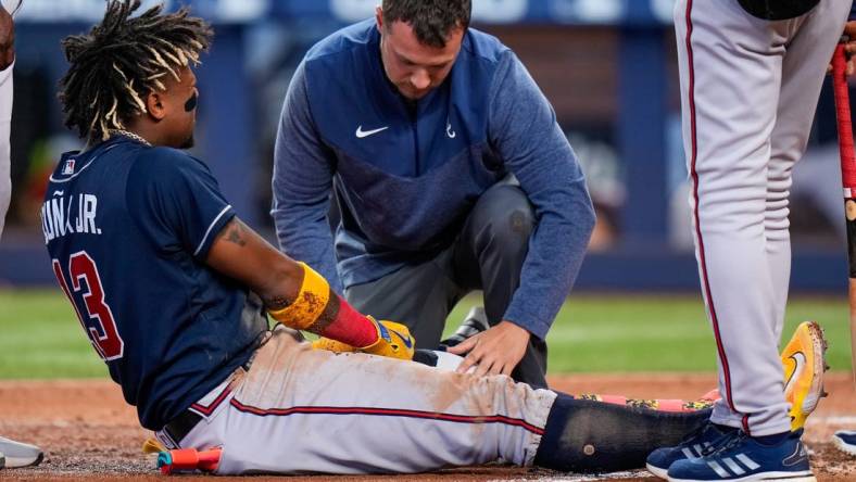 May 4, 2023; Miami, Florida, USA; Atlanta Braves right fielder Ronald Acuna Jr. (13) reacts after being struck by the ball against the Miami Marlins during the sixth inning at loanDepot Park. Mandatory Credit: Rich Storry-USA TODAY Sports