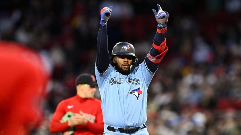 May 4, 2023; Boston, Massachusetts, USA; Toronto Blue Jays first baseman Vladimir Guerrero Jr. (27) reacts after hitting a RBI double against the Boston Red Sox during the fifth inning at Fenway Park. Mandatory Credit: Brian Fluharty-USA TODAY Sports