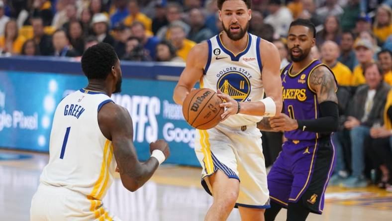 May 4, 2023; San Francisco, California, USA; Golden State Warriors guard Klay Thompson (11) holds onto a rebound against the Los Angeles Lakers in the first quarter during game two of the 2023 NBA playoffs at the Chase Center. Mandatory Credit: Cary Edmondson-USA TODAY Sports