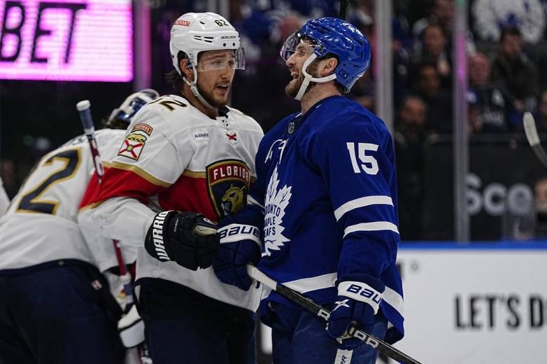 May 4, 2023; Toronto, Ontario, CANADA; Florida Panthers defenseman Brandon Montour (62) and Toronto Maple Leafs forward Alexander Kerfoot (15) talk during a break in the action during the third period of game two of the second round of the 2023 Stanley Cup Playoffs at Scotiabank Arena. Mandatory Credit: John E. Sokolowski-USA TODAY Sports