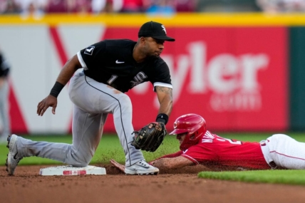 Cincinnati Reds shortstop Kevin Newman (28) dives in ahead of a tag from Chicago White Sox shortstop Elvis Andrus (1), stealing second, in the third inning of the MLB Interleague game between the Cincinnati Reds and the Chicago White Sox at Great American Ball Park in downtown Cincinnati on Friday, May 5, 2023.