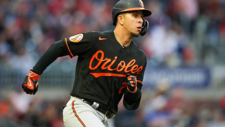 May 5, 2023; Atlanta, Georgia, USA; Baltimore Orioles second baseman Ramon Urias (29) hits a single against the Atlanta Braves in the second inning at Truist Park. Mandatory Credit: Brett Davis-USA TODAY Sports