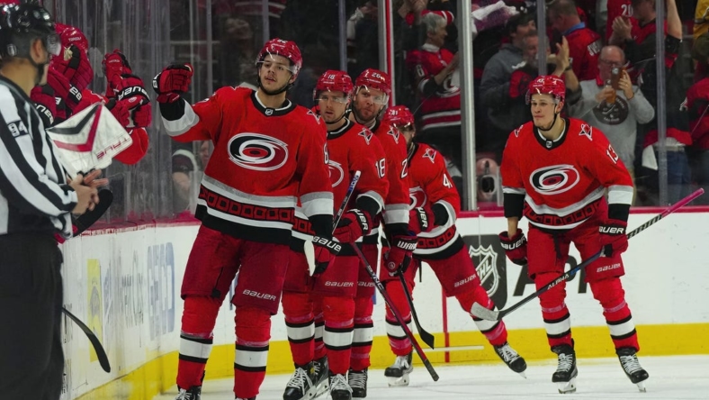 May 5, 2023; Raleigh, North Carolina, USA; Carolina Hurricanes center Jesperi Kotkaniemi (82) scores a goal against the New Jersey Devils during the second period in game two of the second round of the 2023 Stanley Cup Playoffs at PNC Arena. Mandatory Credit: James Guillory-USA TODAY Sports