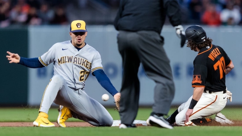 May 5, 2023; San Francisco, California, USA;  San Francisco Giants second baseman Brett Wisely (70) steals second base in front of Milwaukee Brewers shortstop Willy Adames (27) during the second inning at Oracle Park. Mandatory Credit: John Hefti-USA TODAY Sports