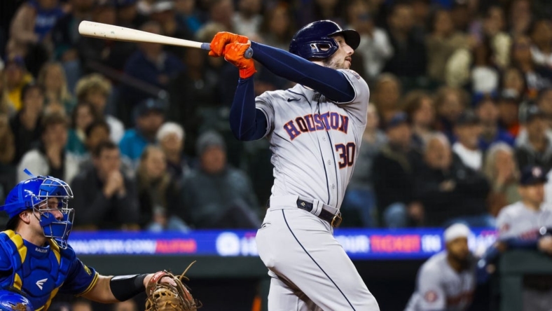 May 5, 2023; Seattle, Washington, USA; Houston Astros right fielder Kyle Tucker (30) hits a two-run home run against the Seattle Mariners during the ninth inning at T-Mobile Park. Mandatory Credit: Joe Nicholson-USA TODAY Sports