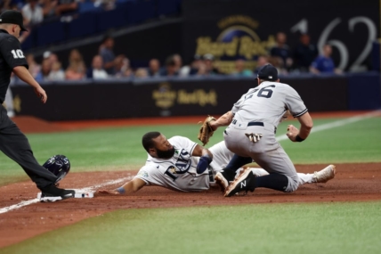 May 6, 2023; St. Petersburg, Florida, USA; Tampa Bay Rays center fielder Manuel Margot (13) is tagged out by New York Yankees second baseman Gleyber Torres (25) during the sixth inning at Tropicana Field. Mandatory Credit: Kim Klement-USA TODAY Sports