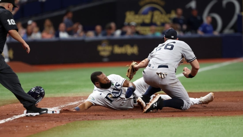 May 6, 2023; St. Petersburg, Florida, USA; Tampa Bay Rays center fielder Manuel Margot (13) is tagged out by New York Yankees second baseman Gleyber Torres (25) during the sixth inning at Tropicana Field. Mandatory Credit: Kim Klement-USA TODAY Sports