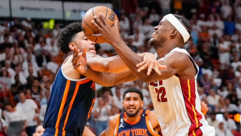 May 6, 2023; Miami, Florida, USA; New York Knicks guard Quentin Grimes (6) fouls Miami Heat forward Jimmy Butler (22) during the second half of game three of the 2023 NBA playoffs at Kaseya Center. Mandatory Credit: Rich Storry-USA TODAY Sports