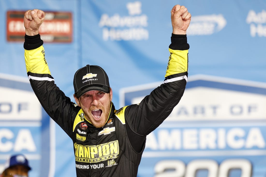 May 6, 2023; Kansas City, Kansas, USA; NASCAR Truck Series driver Grant Enfinger (23) reacts after winning the Heart of America 200 at Kansas Speedway. Mandatory Credit: Mike Dinovo-USA TODAY Sports