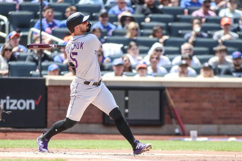 May 7, 2023; New York City, New York, USA; Colorado Rockies designated hitter Randal Grichuk (15) hits a home run in the first inning against the New York Mets at Citi Field. Mandatory Credit: Wendell Cruz-USA TODAY Sports