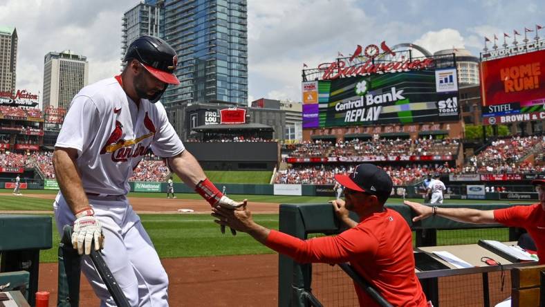 May 7, 2023; St. Louis, Missouri, USA;  St. Louis Cardinals first baseman Paul Goldschmidt (46) is congratulated by manager Oliver Marmol (37) after hitting a solo home run against the Detroit Tigers during the third inning at Busch Stadium. Mandatory Credit: Jeff Curry-USA TODAY Sports