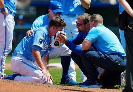 May 7, 2023; Kansas City, Missouri, USA; Kansas City Royals relief pitcher Ryan Yarbrough (48) is attended to by medical staff after being hit by a line drive off the bat of Oakland Athletics first baseman Ryan Noda (not pictured) during the sixth inning at Kauffman Stadium. Mandatory Credit: Jay Biggerstaff-USA TODAY Sports