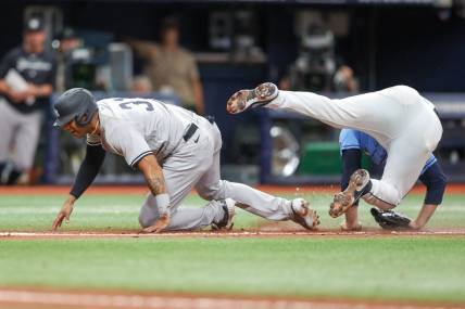 May 7, 2023; St. Petersburg, Florida, USA;  New York Yankees left fielder Aaron Hicks (31) collides with Tampa Bay Rays relief pitcher Garrett Cleavinger (60) in the tenth inning at Tropicana Field. Mandatory Credit: Nathan Ray Seebeck-USA TODAY Sports